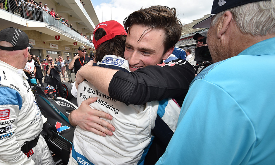 George Steinbrenner IV hugs Colton Herta